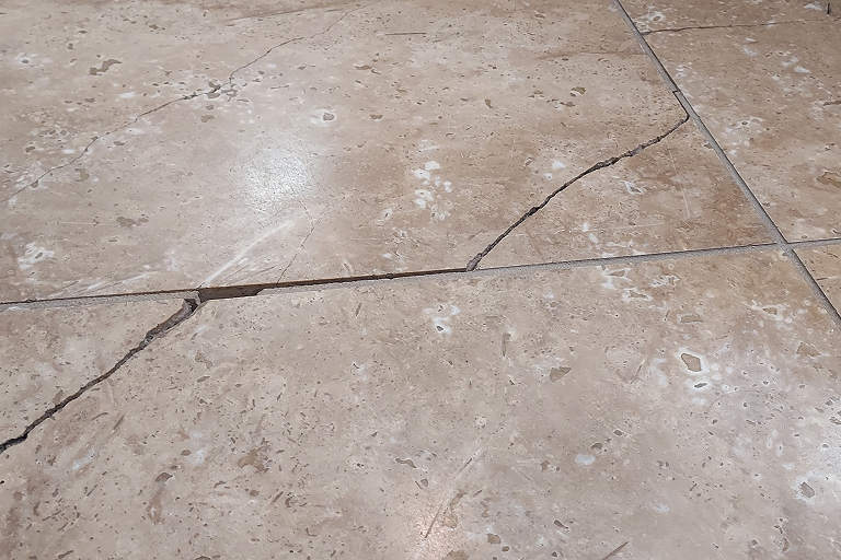 Cracks in Tile or Concrete Floors